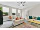 Inviting living room with bright windows, cozy sofas, and a colorful rug creating a warm atmosphere at 4429 Avery Ave, North Charleston, SC 29405