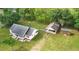 An aerial view of the property shows a home with a shed and detached garage surrounded by well-maintained landscaping at 449 Mary Lou Ln, Moncks Corner, SC 29461