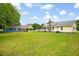 Spacious backyard featuring a well-maintained lawn and a charming outbuilding at 449 Mary Lou Ln, Moncks Corner, SC 29461