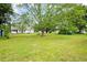 Expansive backyard with mature trees offering ample shade and a peaceful setting at 449 Mary Lou Ln, Moncks Corner, SC 29461