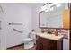 Bathroom featuring wood-style flooring, a modern vanity, and a large mirror with lighting at 449 Mary Lou Ln, Moncks Corner, SC 29461