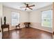 Bedroom featuring hardwood floors, a ceiling fan, and large windows providing natural light at 449 Mary Lou Ln, Moncks Corner, SC 29461