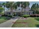 Beautiful clubhouse with palm trees and meticulously manicured lawn creates a welcoming atmosphere at 45 Sycamore Ave # 1532, Charleston, SC 29407