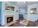 Inviting living room featuring a cozy fireplace and views into the adjacent kitchen at 45 Sycamore Ave # 1532, Charleston, SC 29407