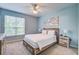 Comfortable main bedroom featuring neutral décor, a ceiling fan, and an ensuite bathroom at 45 Sycamore Ave # 1532, Charleston, SC 29407