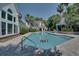 Community pool with a lounge area, palm trees, and inviting outdoor space at 45 Sycamore Ave # 1532, Charleston, SC 29407