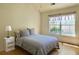 Cozy bedroom with hardwood floors, a full bed and natural light at 462 Maple Oak Ln, Charleston, SC 29414