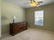 Neutral bedroom featuring a wooden dresser and natural light from the window at 462 Maple Oak Ln, Charleston, SC 29414