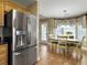 Bright dining area with a wooden table, chairs, and stainless refrigerator at 462 Maple Oak Ln, Charleston, SC 29414