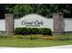 Community entrance sign displaying 'Grand Oaks Plantation' amid lush landscaping at 462 Maple Oak Ln, Charleston, SC 29414