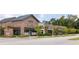 Commercial building featuring retail shops with brick accents, awnings, and well-maintained landscaping at 462 Maple Oak Ln, Charleston, SC 29414