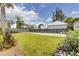 Large backyard with expansive lawn, garden, and a view of the home's rear exterior at 509 Gilberts Lndg, Mount Pleasant, SC 29464
