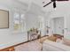 Sunlit bedroom features plantation shutters, a mirrored vanity, and wood floors with a pink shag rug at 509 Gilberts Lndg, Mount Pleasant, SC 29464