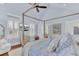 Beautiful bedroom featuring a four poster bed, a ceiling fan, plantation shutters and neutral decor at 509 Gilberts Lndg, Mount Pleasant, SC 29464