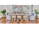 Elegant dining room with stylish chandelier, seating for eight, and views of the kitchen, perfect for gatherings at 509 Gilberts Lndg, Mount Pleasant, SC 29464