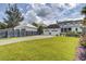 Charming home boasts a manicured lawn, detached garage, and inviting front porch perfect for relaxing at 509 Gilberts Lndg, Mount Pleasant, SC 29464