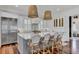 Modern kitchen featuring a large island, stainless steel appliances, pendant lighting, and ample counter space at 509 Gilberts Lndg, Mount Pleasant, SC 29464