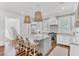 Modern kitchen featuring a large island, stainless steel appliances, pendant lighting, and ample counter space at 509 Gilberts Lndg, Mount Pleasant, SC 29464