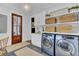 Well-equipped laundry room with modern appliances, storage, and stylish decor at 509 Gilberts Lndg, Mount Pleasant, SC 29464