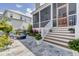 Outdoor patio with steps leading down and a glimpse of a screened-in porch and backyard at 509 Gilberts Lndg, Mount Pleasant, SC 29464
