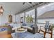 Bright outdoor porch showcasing wicker furniture, a ceiling fan, and views of the neighborhood at 509 Gilberts Lndg, Mount Pleasant, SC 29464