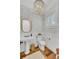 Charming powder room with pedestal sink, leafy wallpaper, and natural light at 509 Gilberts Lndg, Mount Pleasant, SC 29464