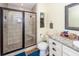 Stylish bathroom with glass shower, tiled walls, vanity with storage, and granite countertop at 5153 Celtic Dr, North Charleston, SC 29405