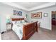 Bedroom with a sleigh bed, side tables with lamps, carpeted floors and an artistically decorated wall at 5153 Celtic Dr, North Charleston, SC 29405