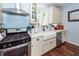 A well-appointed kitchen features a stainless steel gas range, white cabinets and a farmhouse sink at 5153 Celtic Dr, North Charleston, SC 29405