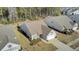 Aerial view of a single-Gathering home showcasing the roof, landscaping, driveway, and surrounding neighborhood at 534 Four Seasons Blvd, Summerville, SC 29486