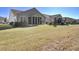 Expansive backyard featuring a screened-in porch and plenty of green space for outdoor enjoyment at 534 Four Seasons Blvd, Summerville, SC 29486