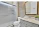 Bathroom features a glass shower, toilet, and vanity with countertop, sink, and decorative mirror at 534 Four Seasons Blvd, Summerville, SC 29486