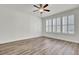 Spacious bedroom features wood floors and multiple windows, providing ample natural light at 534 Four Seasons Blvd, Summerville, SC 29486