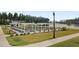 Outdoor bocce ball court with pergola and lakeside view at 534 Four Seasons Blvd, Summerville, SC 29486
