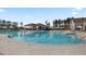 Beautiful community pool area with sun loungers, umbrellas, and a cabana for residents to enjoy at 534 Four Seasons Blvd, Summerville, SC 29486