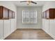 Bright dining room features wood floors, modern wainscoting, upper cabinets, and a large window at 534 Four Seasons Blvd, Summerville, SC 29486