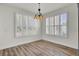 Sunlit dining area with shuttered windows and elegant lighting at 534 Four Seasons Blvd, Summerville, SC 29486