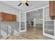 Dining Room featuring wood floors, wainscoting, with a view of the open-concept kitchen and breakfast nook at 534 Four Seasons Blvd, Summerville, SC 29486