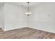 Dining room with chair rail, wall molding, and modern chandelier at 534 Four Seasons Blvd, Summerville, SC 29486