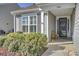 Front porch with plants, an armchair, and attractive landscaping surrounding the home at 534 Four Seasons Blvd, Summerville, SC 29486