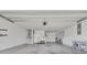 Spacious and well-lit three car garage with ample storage space, a door to the backyard, and overhead lighting at 534 Four Seasons Blvd, Summerville, SC 29486
