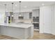 Modern kitchen with a central island, stainless steel appliances, and stylish pendant lighting at 534 Four Seasons Blvd, Summerville, SC 29486