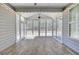 Enclosed sunroom with windows and tile flooring at 534 Four Seasons Blvd, Summerville, SC 29486