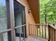 Back porch features wooden railing and screens on the door, with views of the backyard at 5354 Ceva Dr, Hollywood, SC 29449