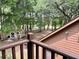 View from the back porch onto a beautiful backyard with shed and many trees at 5354 Ceva Dr, Hollywood, SC 29449