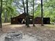 Spacious barn with open sides and a fire pit, perfect for outdoor gatherings and storage at 5354 Ceva Dr, Hollywood, SC 29449