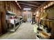 Interior view of an organized barn featuring work benches, shelving, and tools for projects at 5354 Ceva Dr, Hollywood, SC 29449