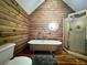 Cozy bathroom with free standing tub, shower, and stained glass window at 5354 Ceva Dr, Hollywood, SC 29449