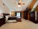 The bedroom boasts carpeted floors, ceiling fan, and wood walls at 5354 Ceva Dr, Hollywood, SC 29449