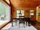 Dining room with wood table, chairs, and adjacent grill at 5354 Ceva Dr, Hollywood, SC 29449